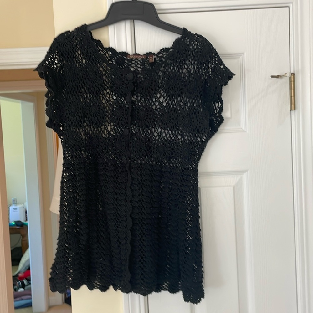 Black crocheted sweater.
